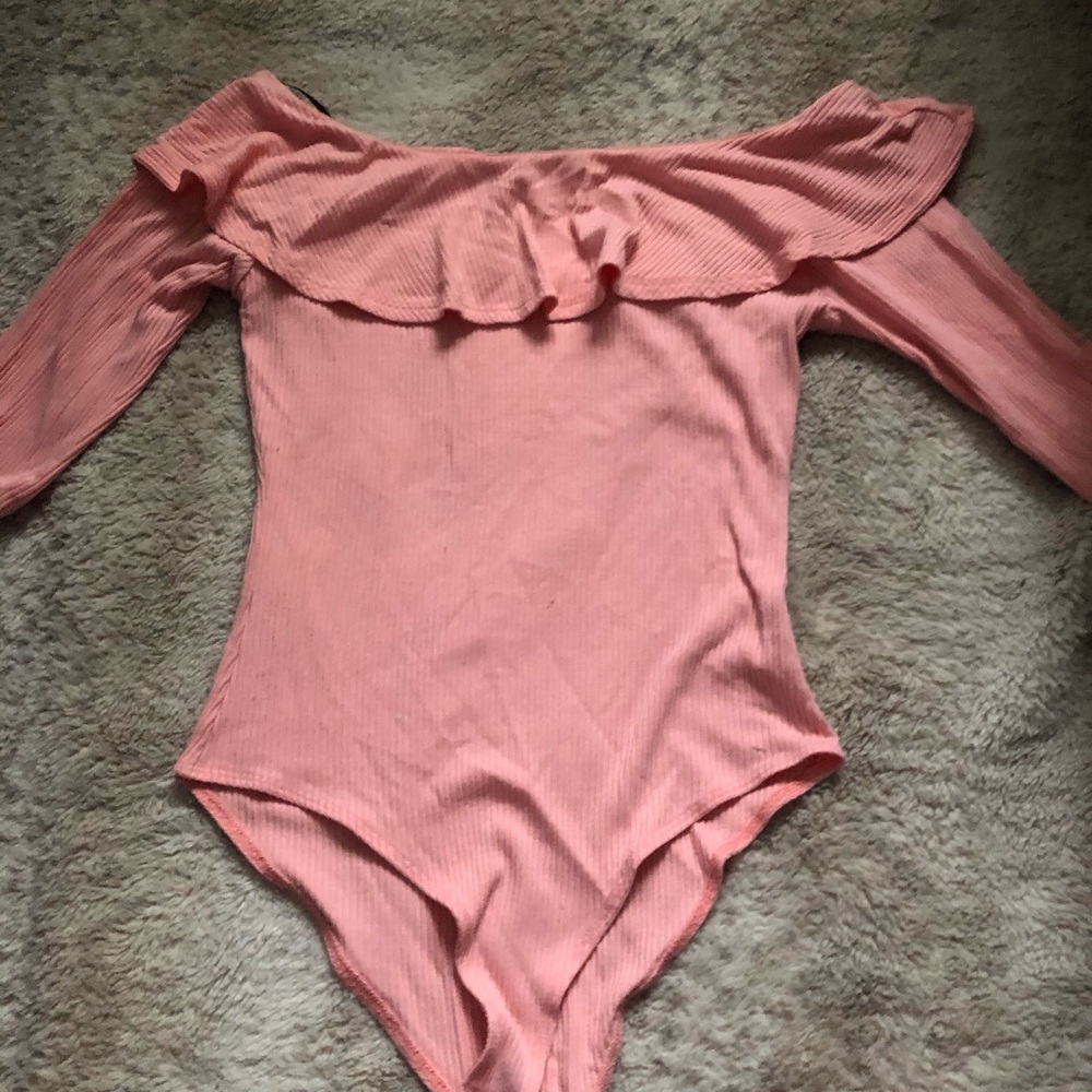 A pink off the shoulder bodysuit